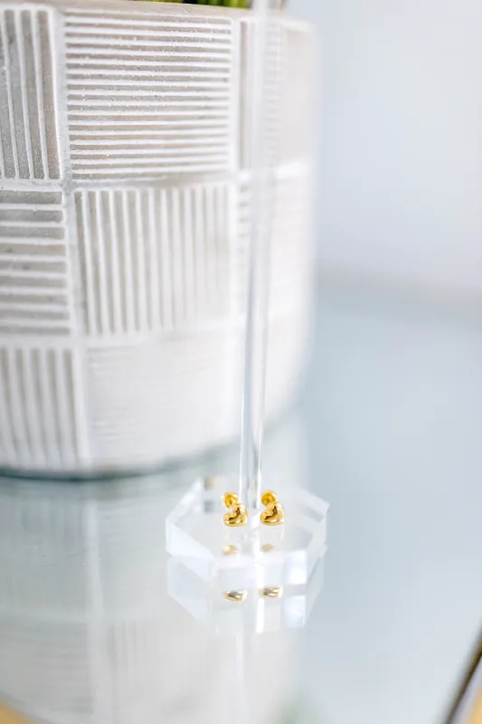 Heart of gold stud earrings sold by shop taby