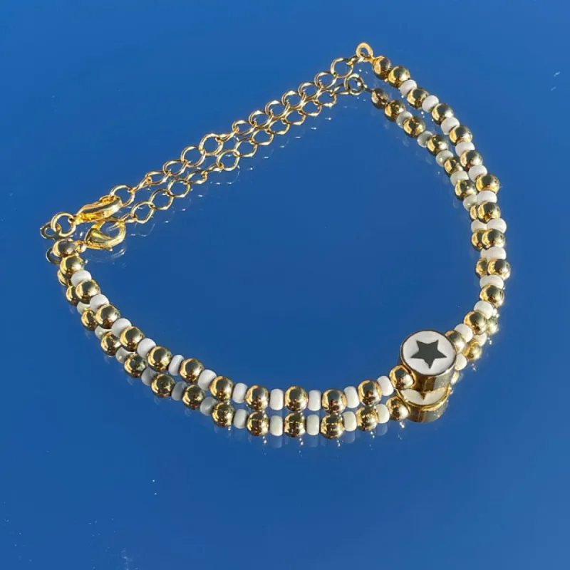 Gold/White Star Lucky Bracelet sold by Never Fully Dressed