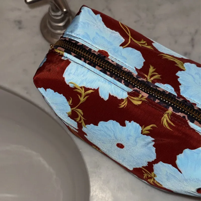 Blue & Burgundy Poppy Reversible Make Up Bag sold by Never Fully Dressed