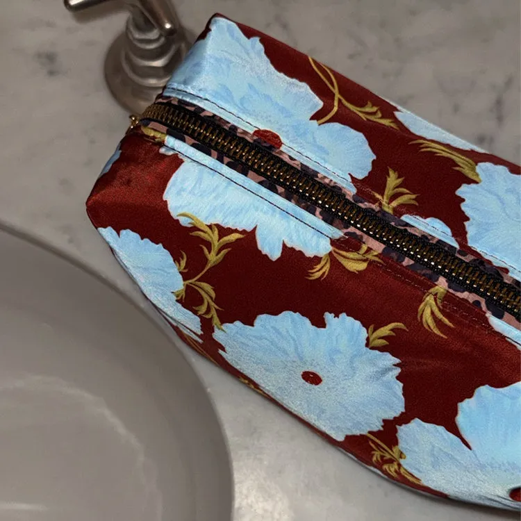 Blue & Burgundy Poppy Reversible Make Up Bag sold by Never Fully Dressed