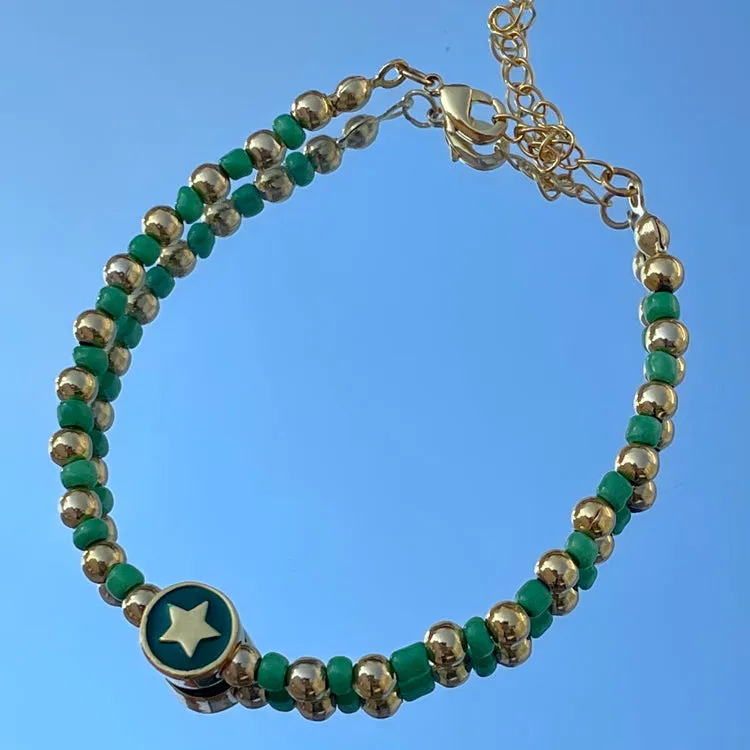 Gold/Green Star Lucky Bracelet sold by Never Fully Dressed