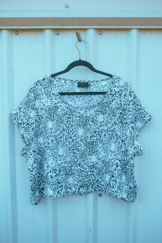 Snow Leopard Crop Top sold by Copper Union Apparel