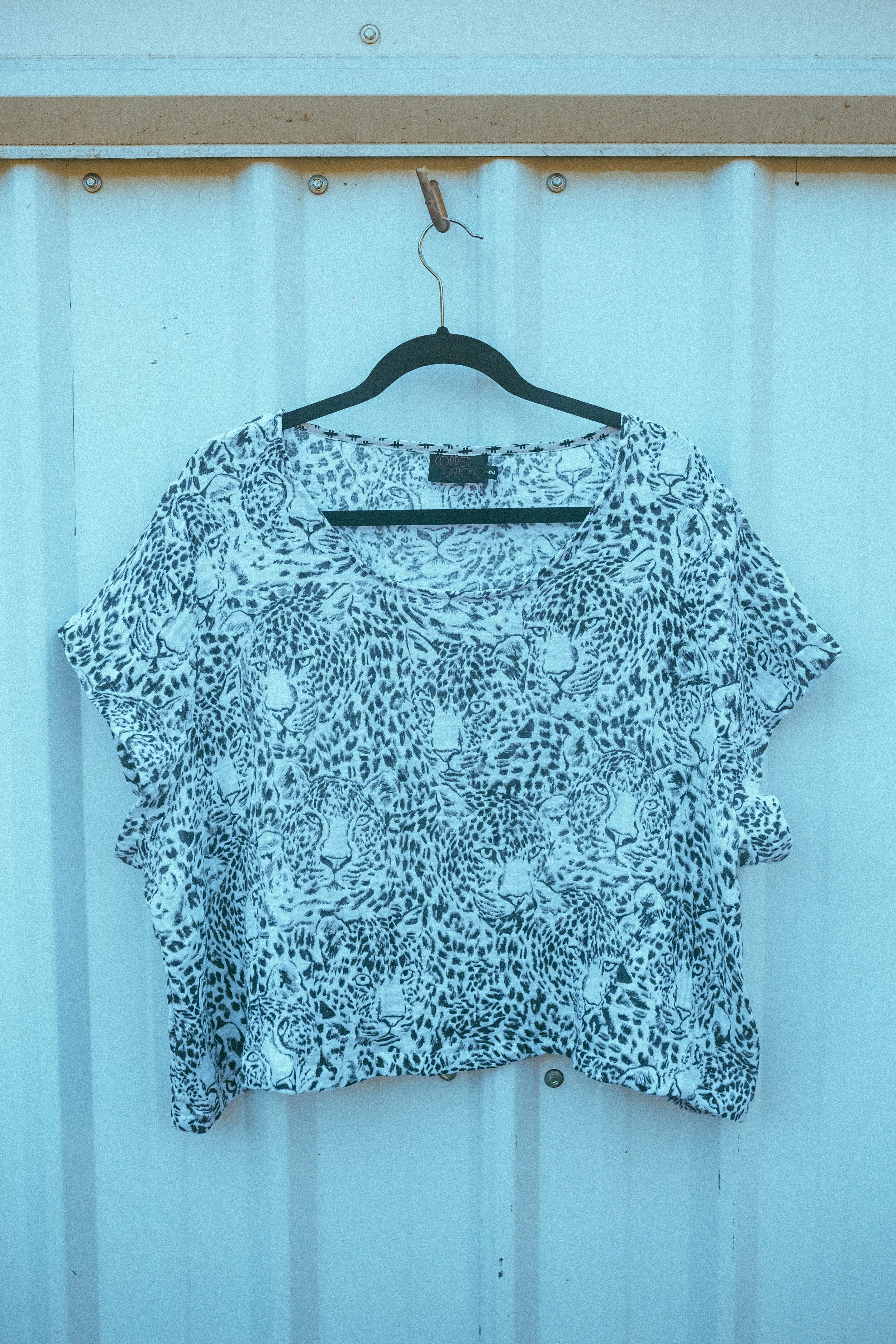 Snow Leopard Crop Top sold by Copper Union Apparel