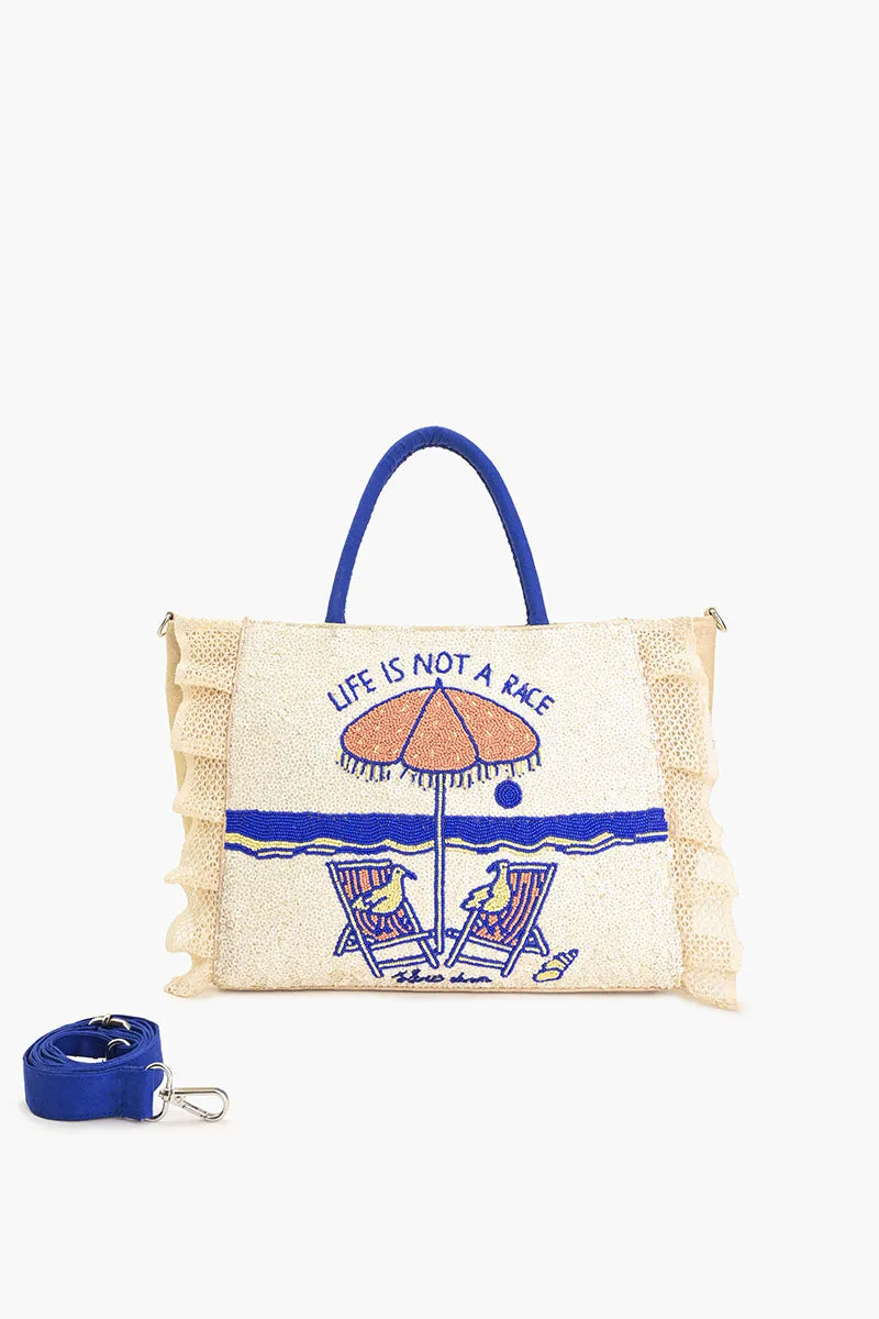 Slow Down Beaded Beach Bag sold by America & Beyond