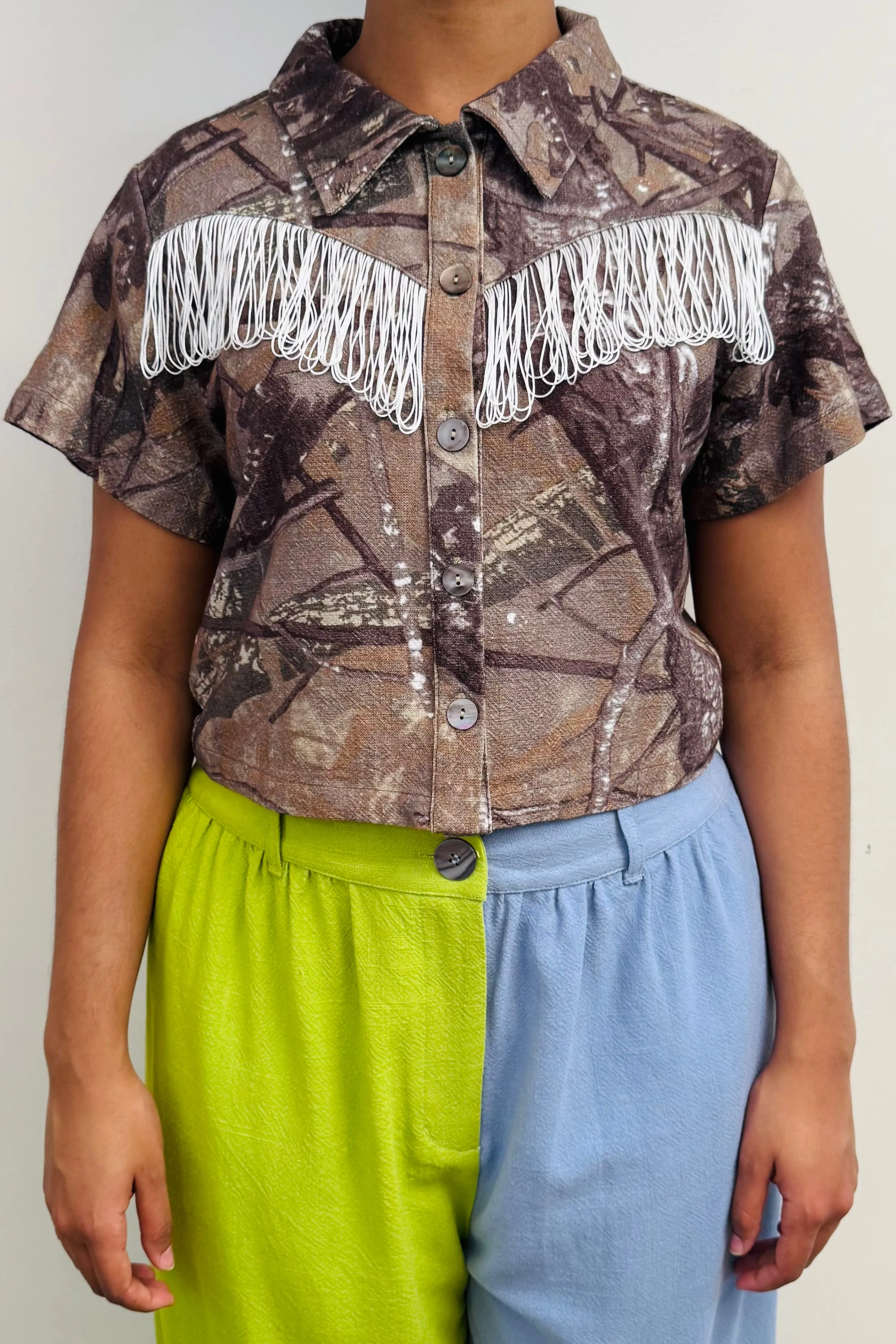 SAMPLE #144 - S Camo Fringe Top sold by Fashion Brand Company
