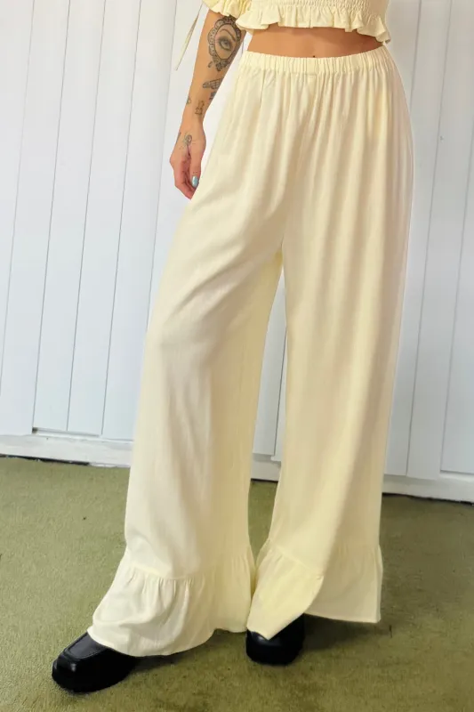 SAMPLE #663 - M Cream Ruffle Łazy Pants sold by Fashion Brand Company