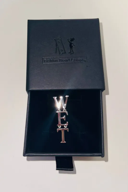 Sterling Silver WET Dangle Earring made by Fashion Brand Company