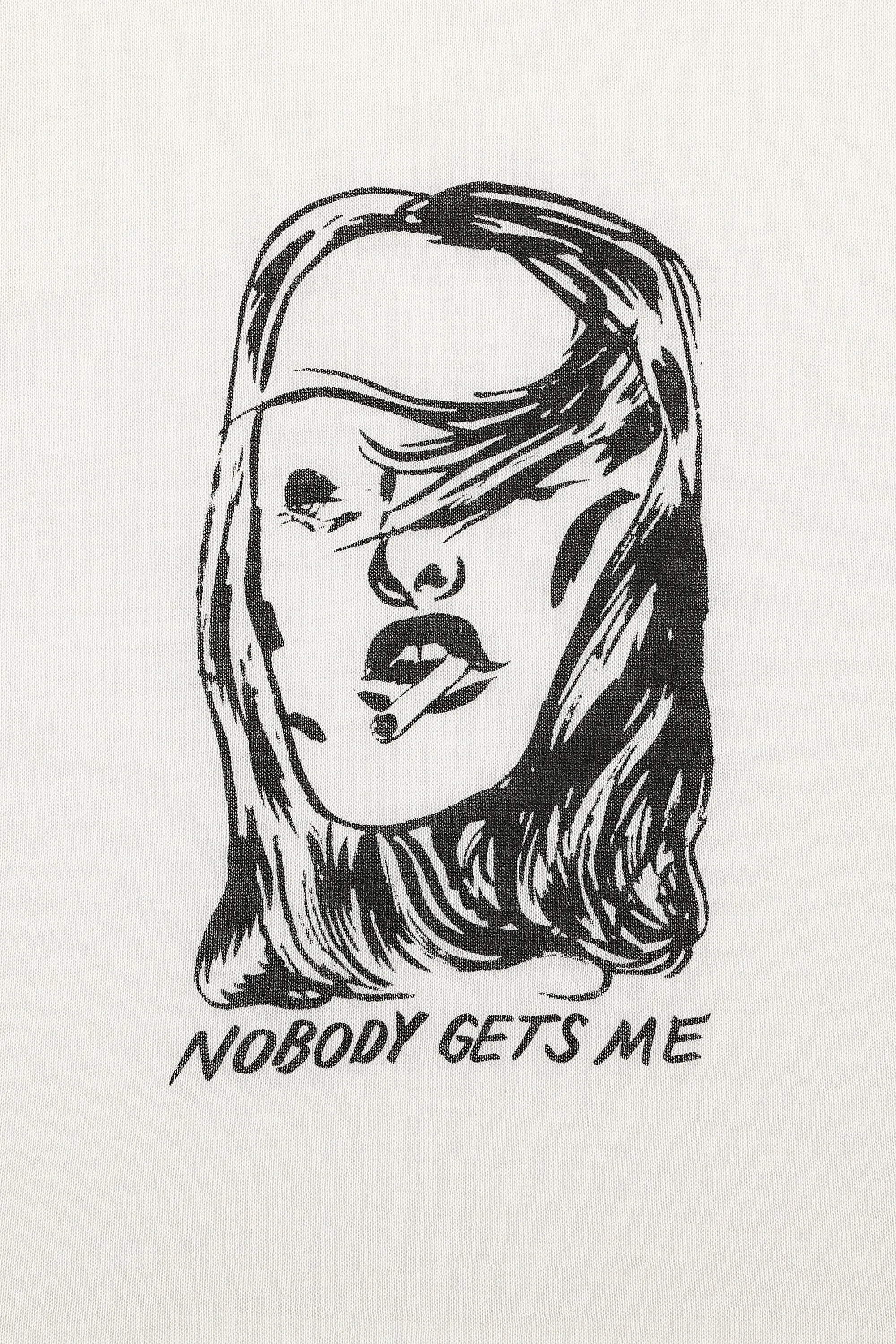 1 left - NOBODY GETS ME Tommy Tee X Nicholas Gazin sold by Fashion Brand Company product image thumbnail 3