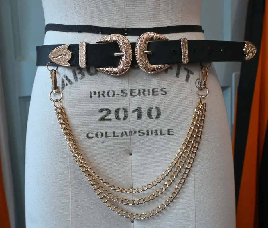 Black Western-style faux leather belt with Gold layered chains sold by Wax Poetic