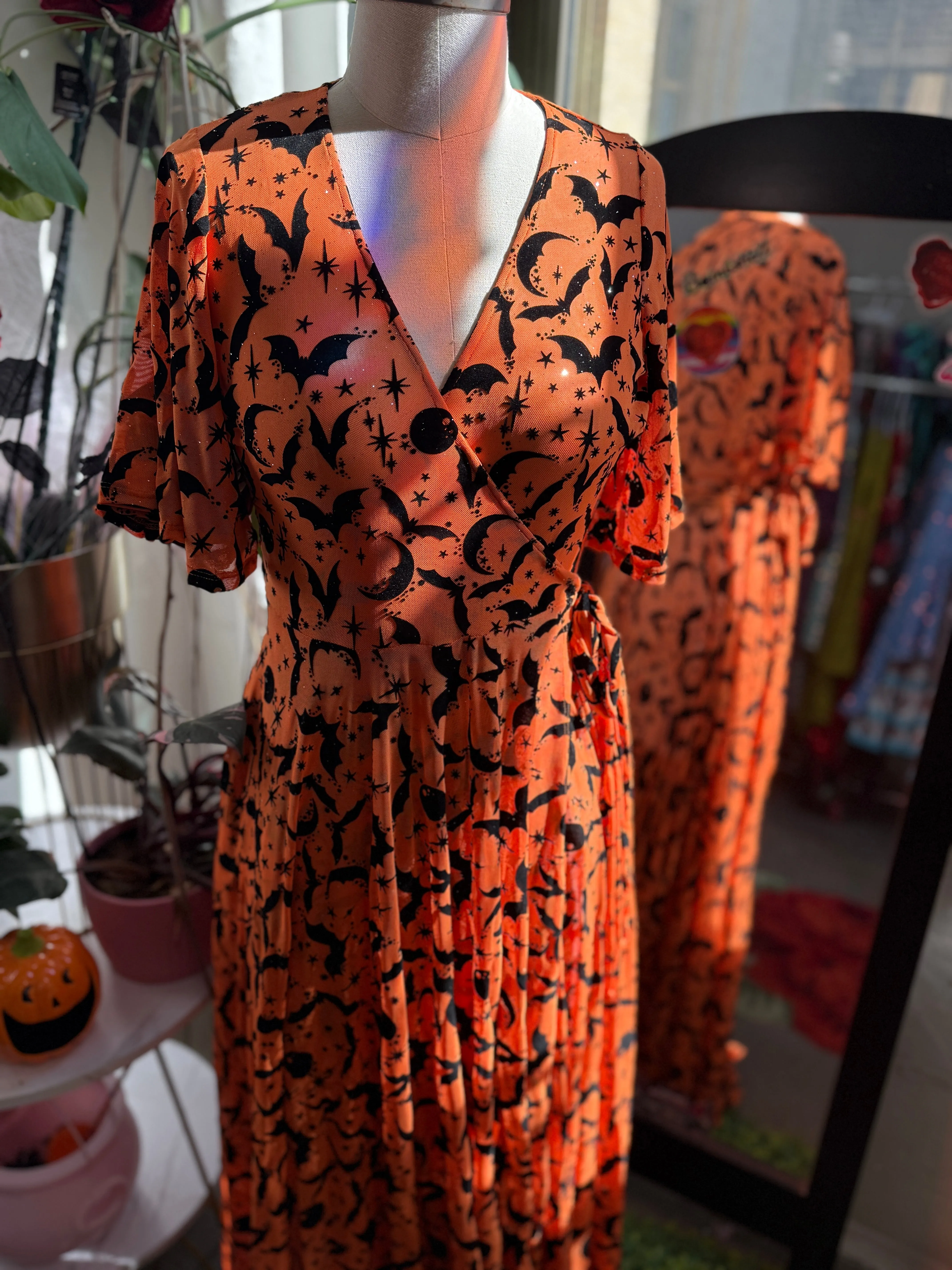 Lydia Wrap Dress in Queen of Halloween Orange Flocked Mesh sold by Wax Poetic