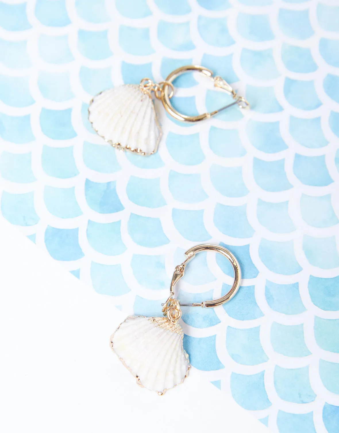 Golden Shell Hoop Earrings sold by 2020 Ave