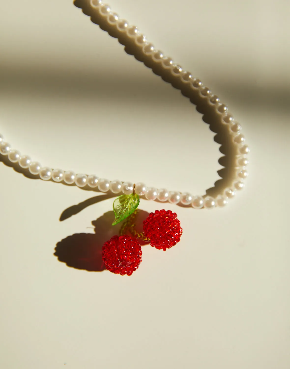 Faux Pearl and Cherry Necklace sold by 2020 Ave