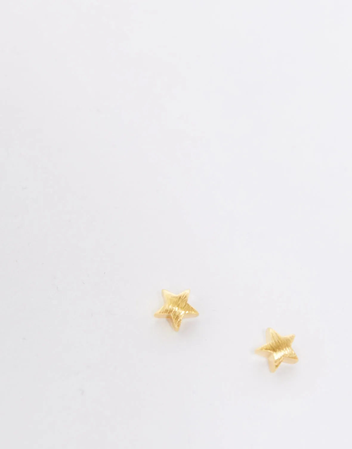 Tiny Star Stud Earrings sold by 2020 Ave