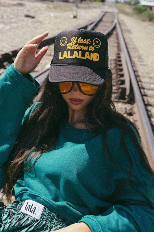 If Lost, Return to Lalaland Puff Print Trucker Hat sold by Dressed In Lala