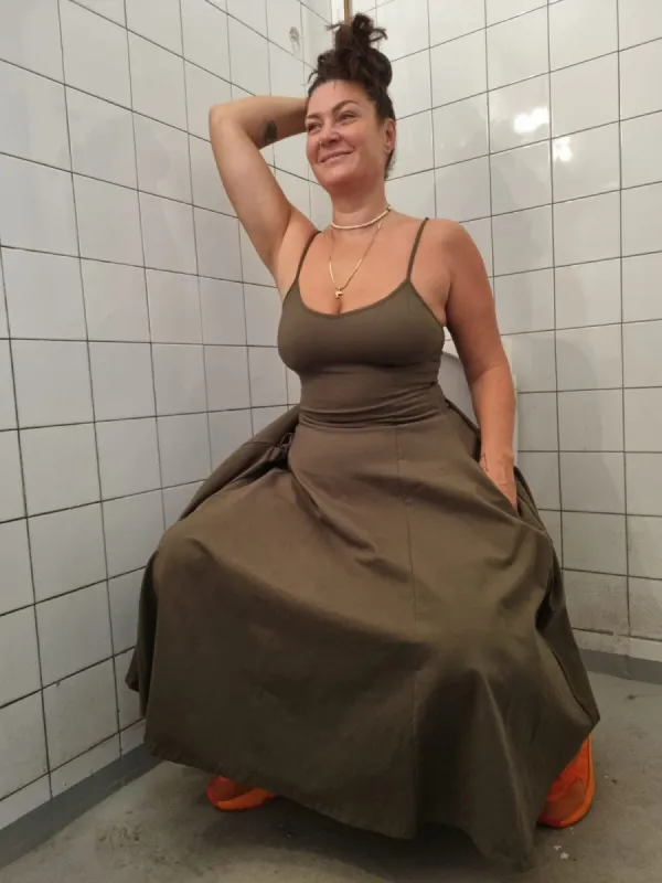 Asri dress in Khaki Green - Limited Addition sold by Manners London