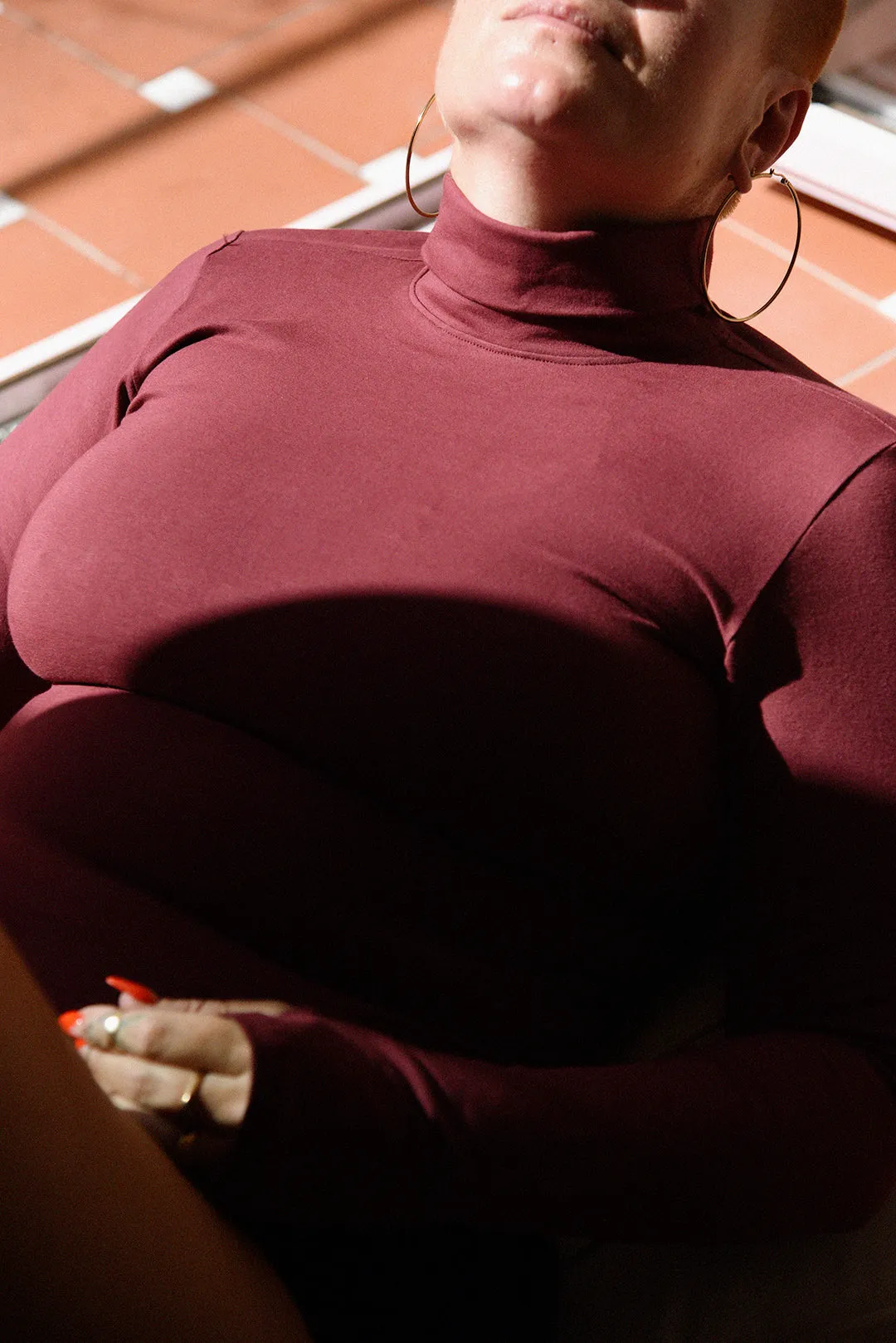 Turtle Neck Long Sleeve Full Length Top with Hole in Tawny Port sold by Manners London