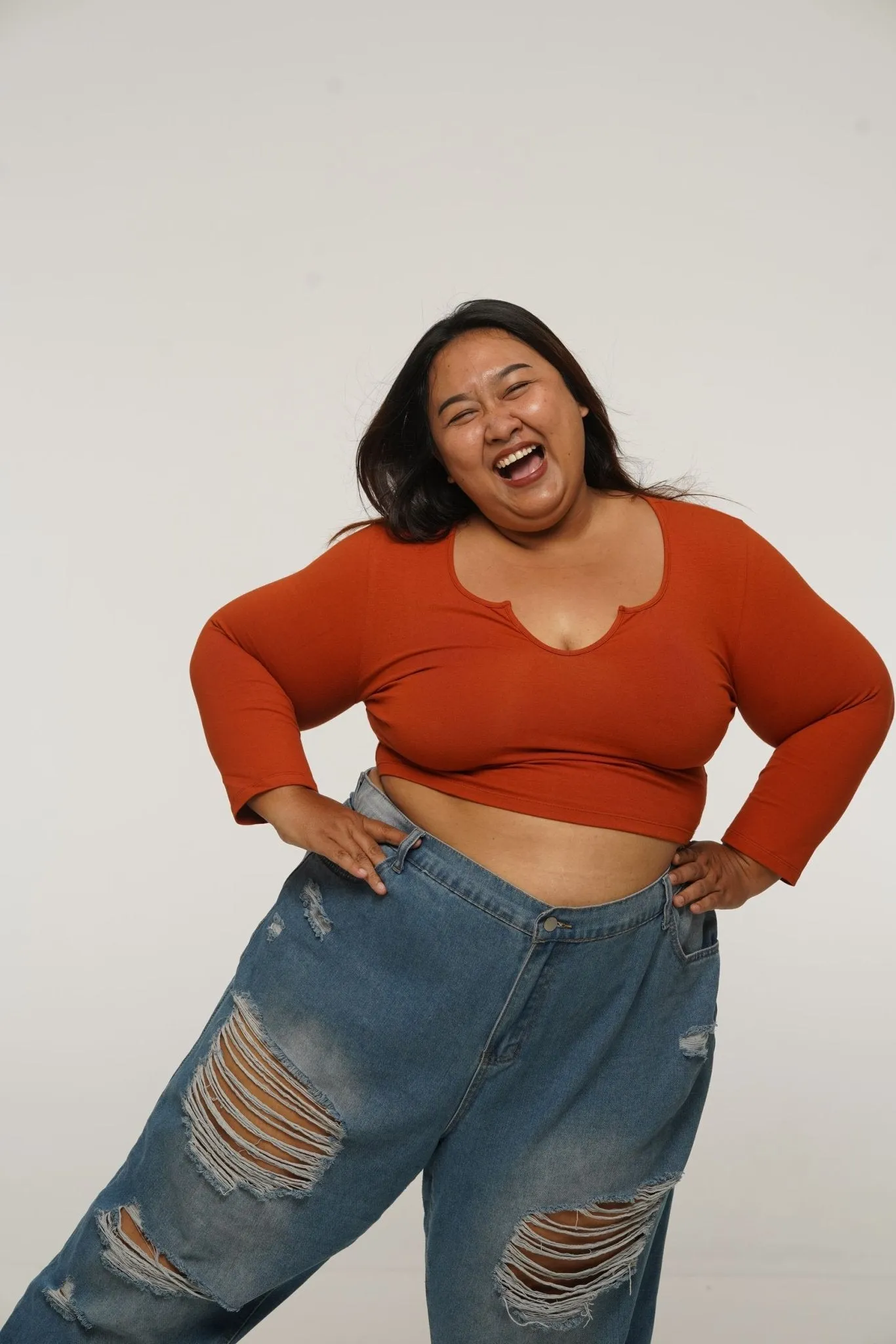 U Front Crop Top with sleeves in Burnt Orange sold by Manners London