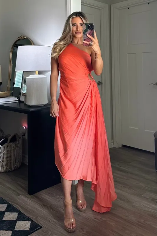Keep My Promises Pleated Asymmetrical Midi Dress: Coral sold by Bella and Bloom