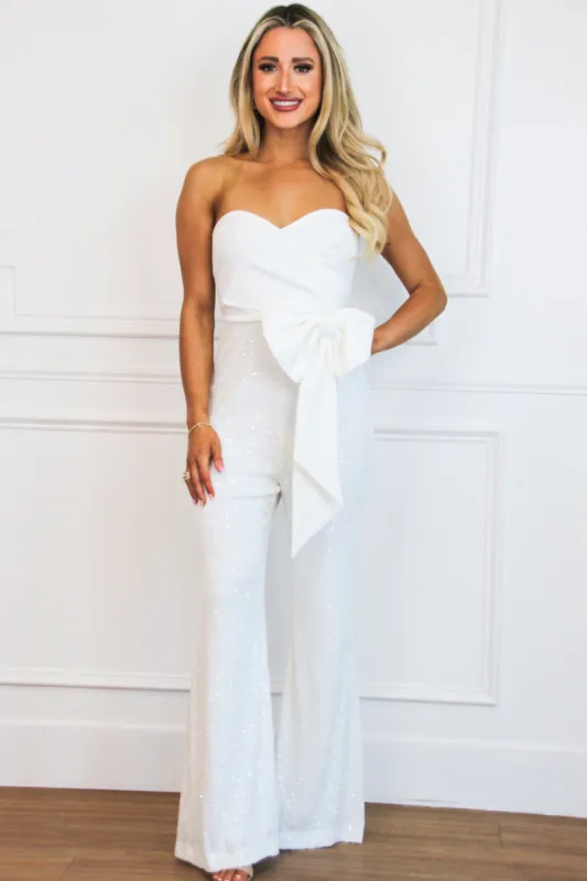 Park Avenue Sequin Bow Jumpsuit: White sold by Bella and Bloom