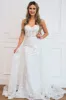 Sealed With A Kiss Bustier Cape Wedding Dress sold by Bella and Bloom