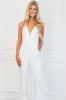 Start the Party Detachable Cape Sequin Jumpsuit: White sold by Bella and Bloom