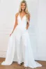 Start the Party Detachable Cape Sequin Jumpsuit: White sold by Bella and Bloom