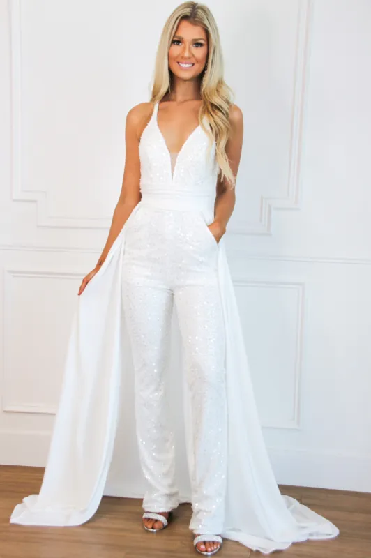 Start the Party Detachable Cape Sequin Jumpsuit: White sold by Bella and Bloom