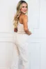 Margot One Shoulder Bow Lace Jumpsuit: Ivory/Nude sold by Bella and Bloom