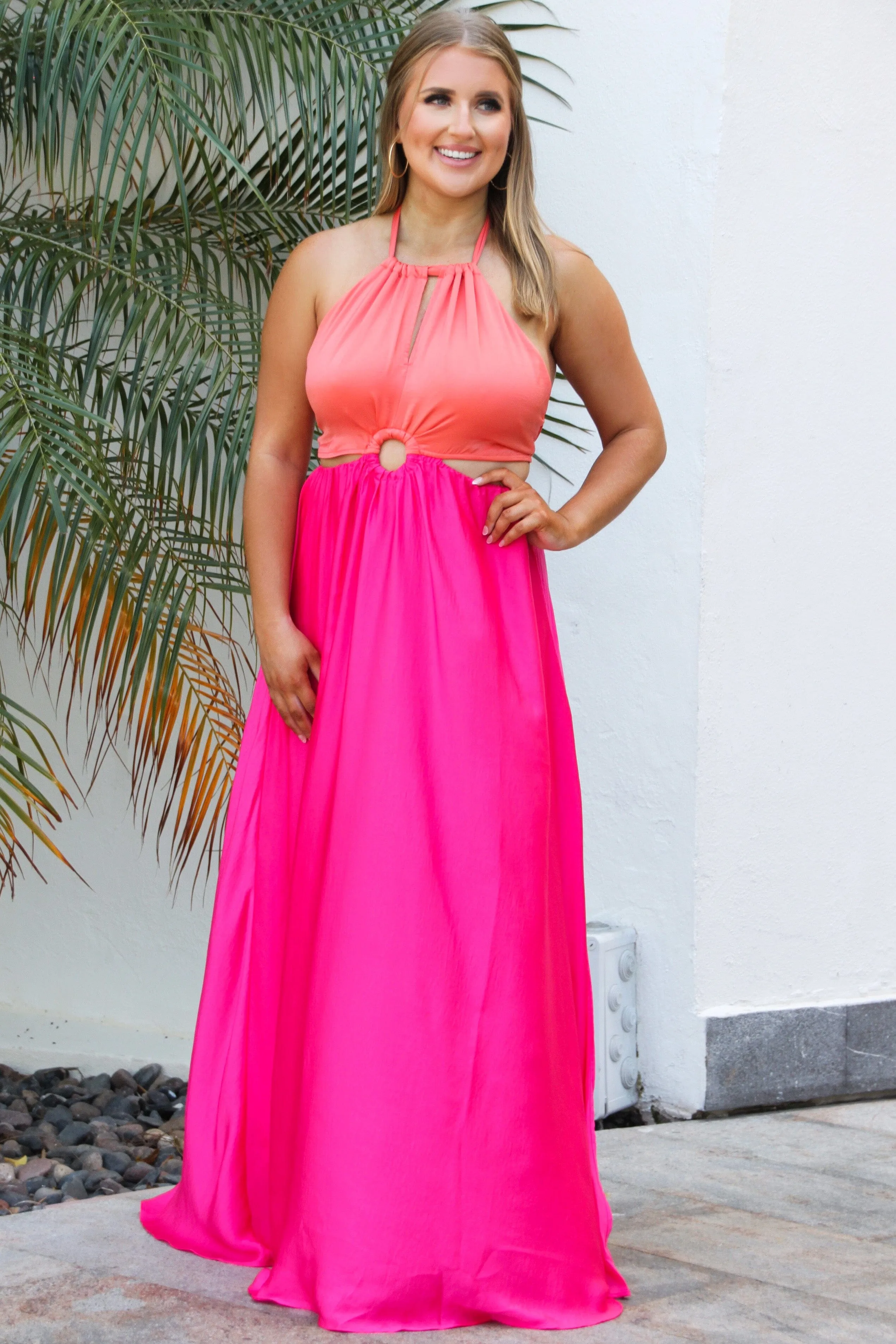 True Desire Colorblock Cutout Maxi Dress: Tangerine/Fuchsia sold by Bella and Bloom