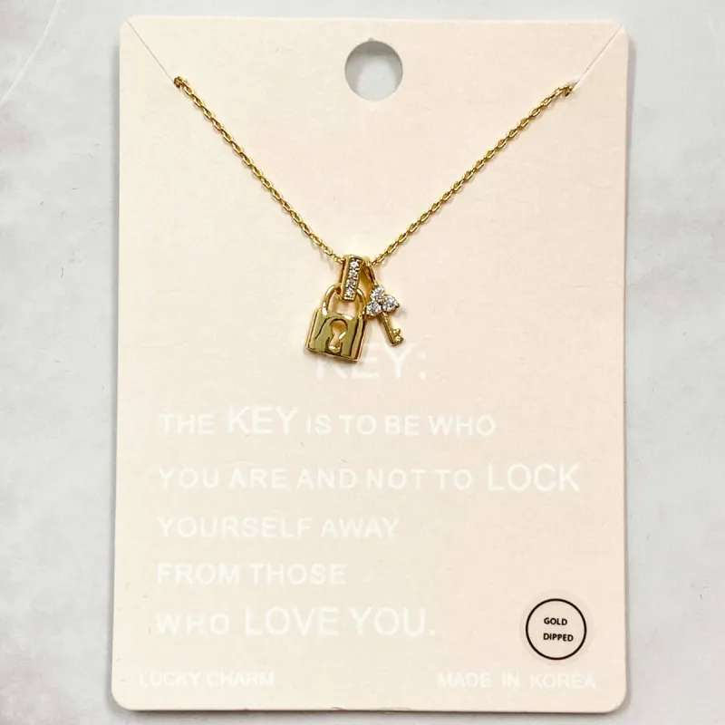 Lock and Key Necklace: Gold sold by Bella and Bloom