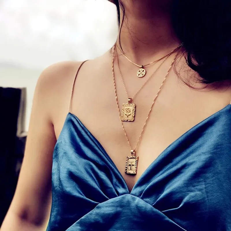 RESTOCK: Layered Rose/Cross Necklace: Gold sold by Bella and Bloom