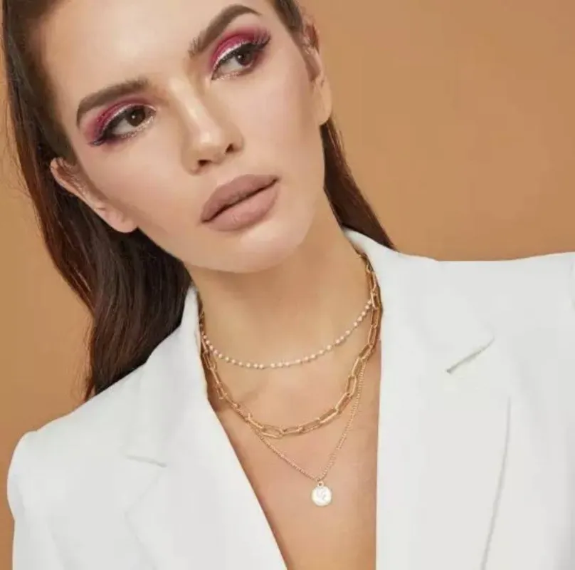 Pearl and Chain Necklace: Gold sold by Bella and Bloom