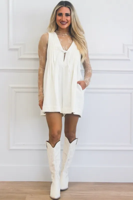 Free Bird Denim Romper: Cream sold by Bella and Bloom