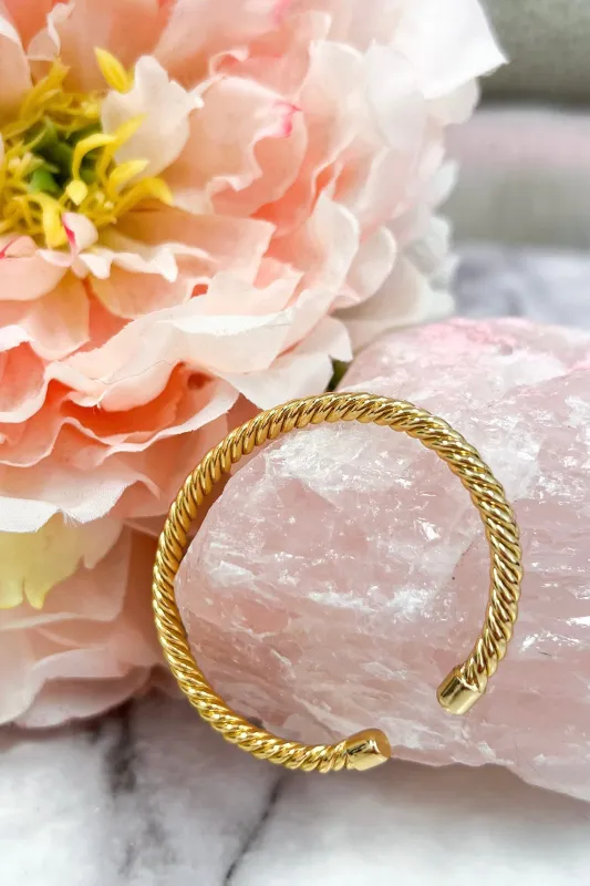 Take My Hand Corded Bangle Bracelet: Gold sold by Bella and Bloom