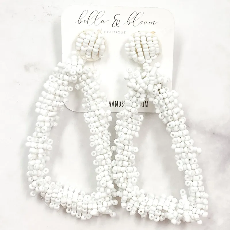 Beaded Triangle Earrings: White sold by Bella and Bloom