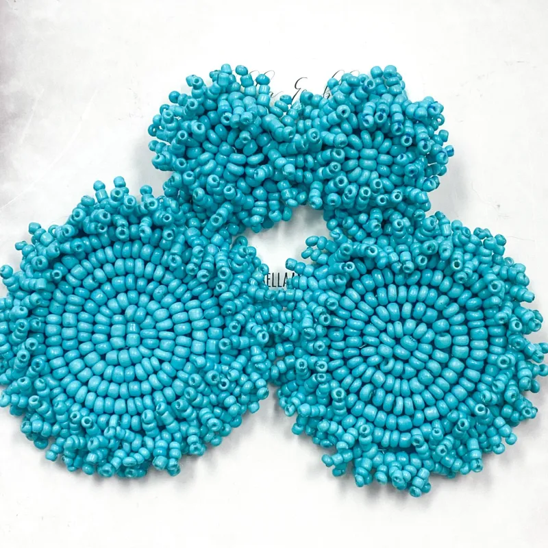 Beaded Disc Earrings: Turquoise sold by Bella and Bloom