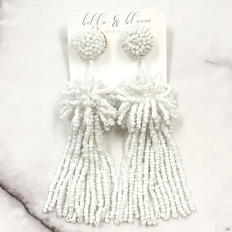 Beaded Burst Tassel Earrings: White sold by Bella and Bloom