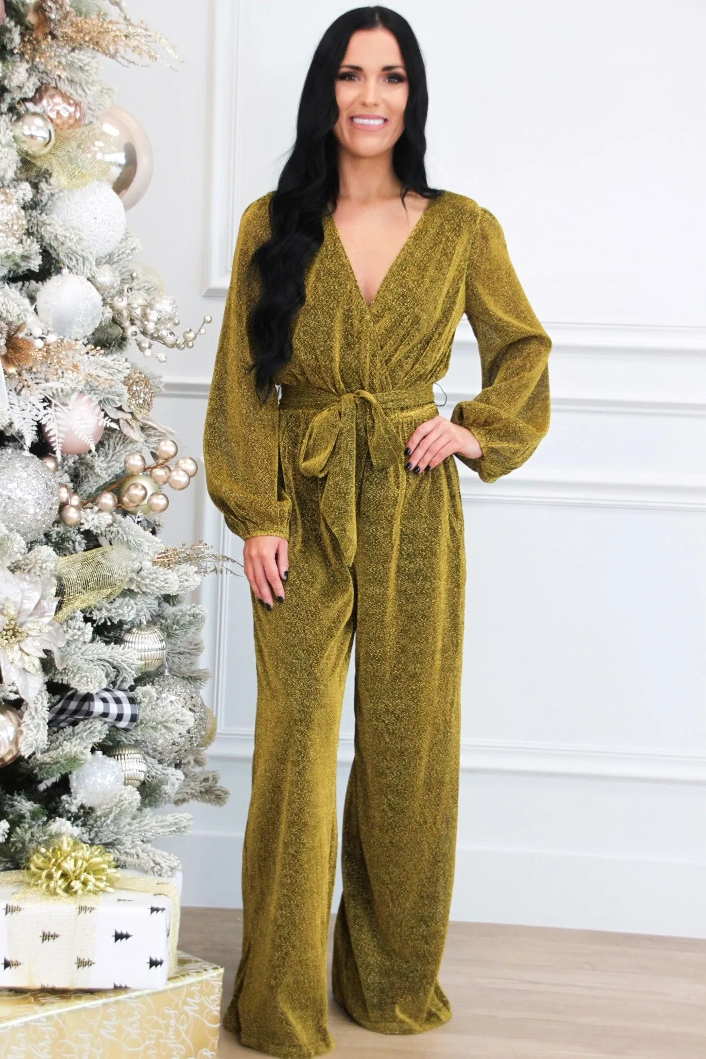 Own the Night Shimmer Long Sleeve Jumpsuit: Gold sold by Bella and Bloom