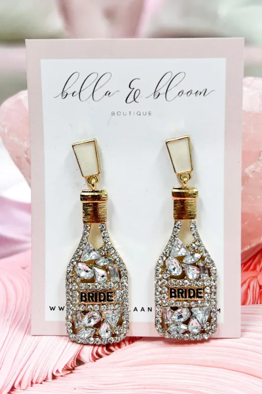 Embellished Champagne Bottle Earrings: Gold sold by Bella and Bloom