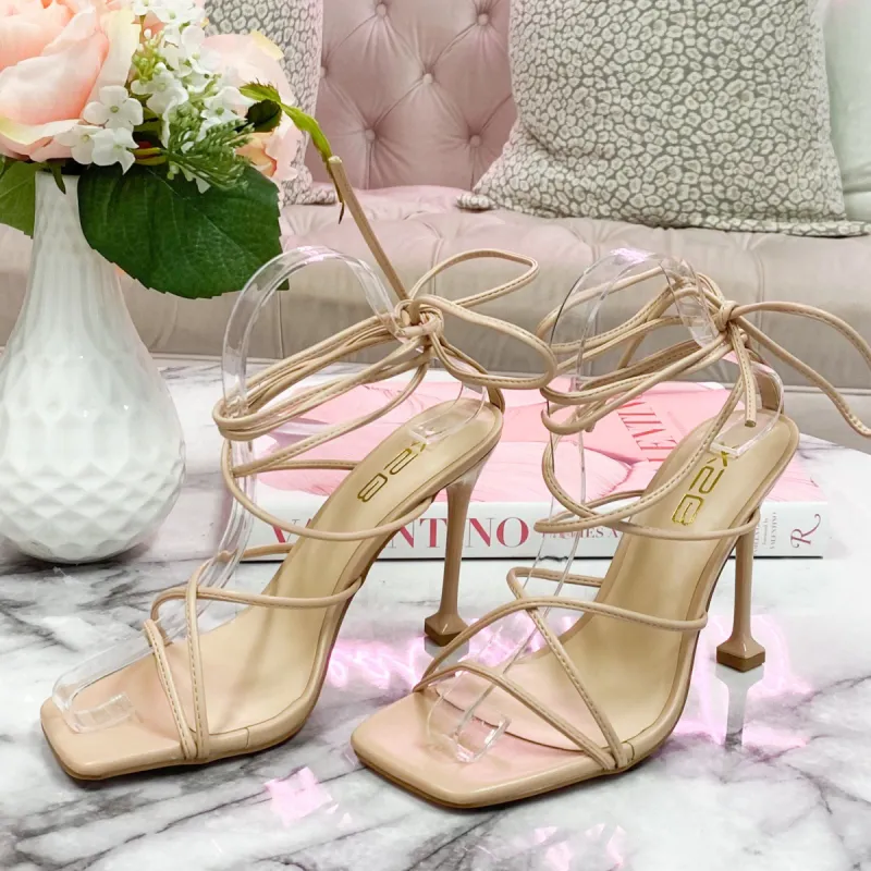 Take Me Downtown Lace Up Heels: Nude sold by Bella and Bloom
