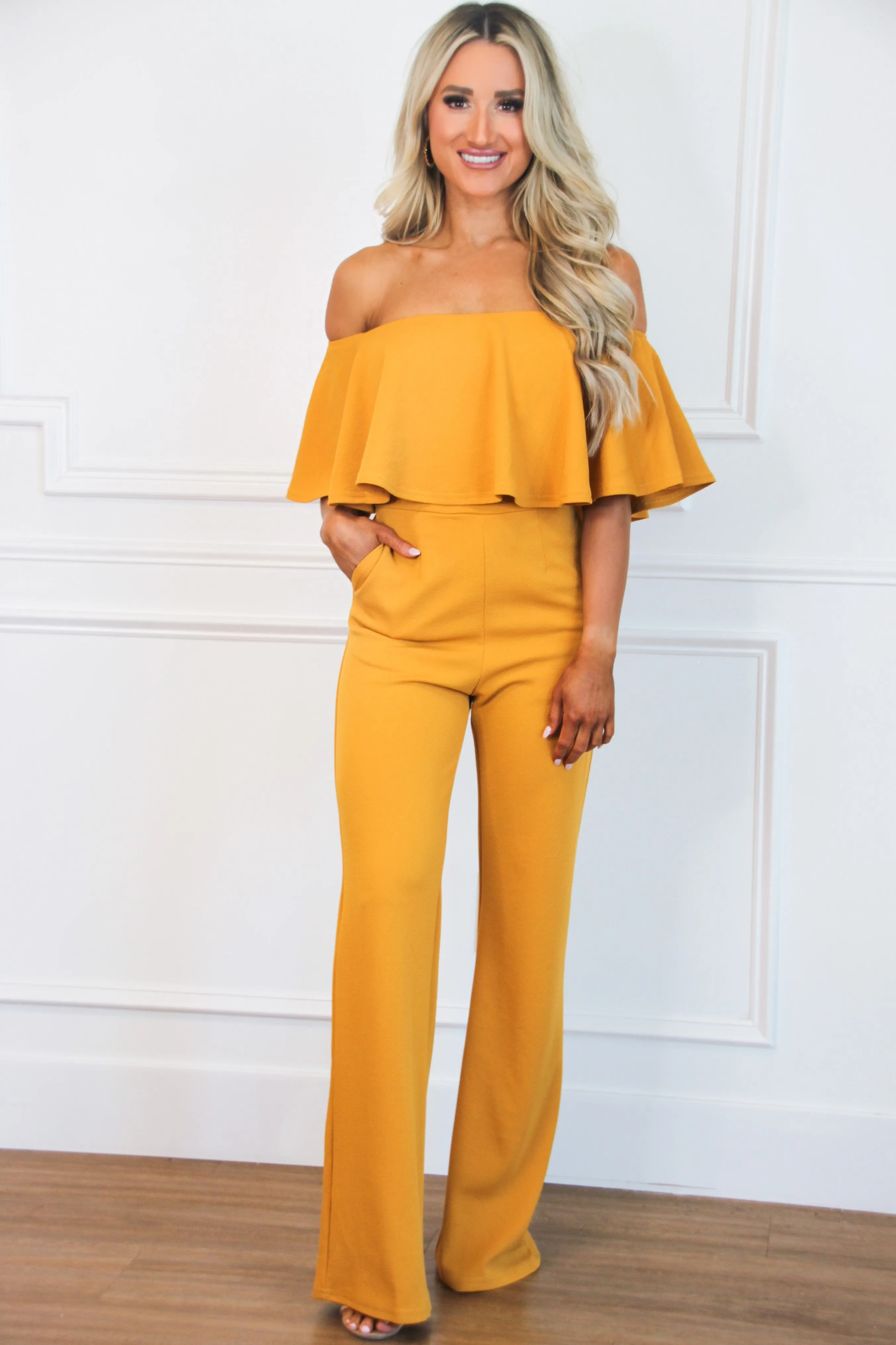 Under Your Spell Jumpsuit: Mustard sold by Bella and Bloom