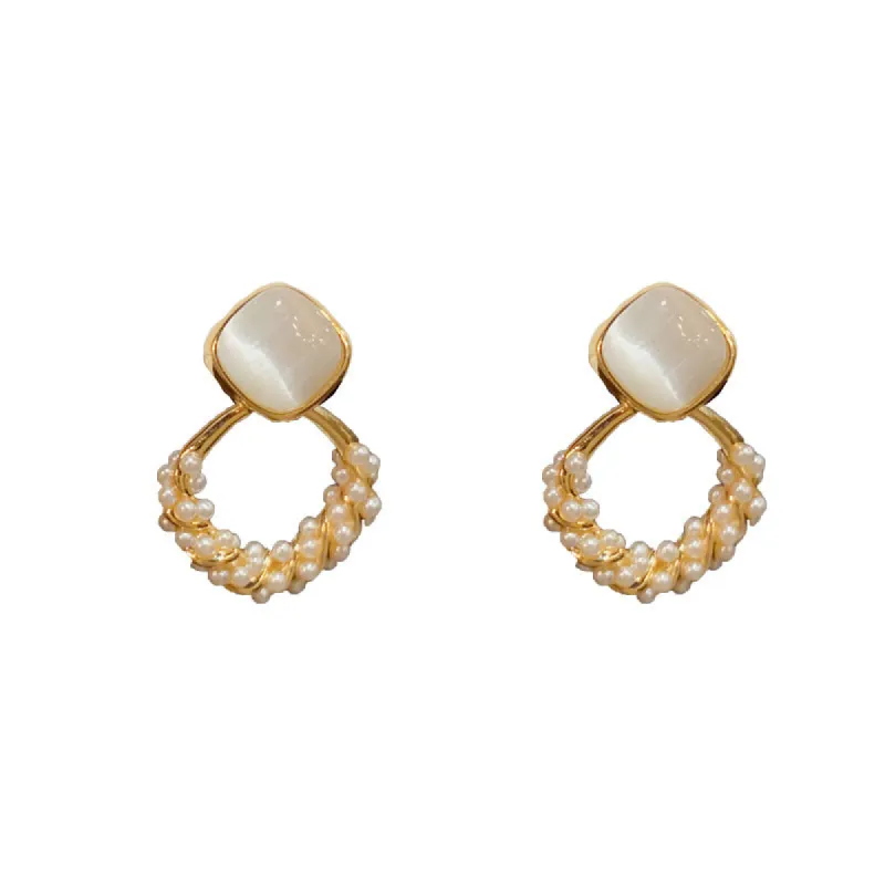 Fashion simple light luxury cat's eye diamond pearl earrings 796095958778 sold by Cocomelody