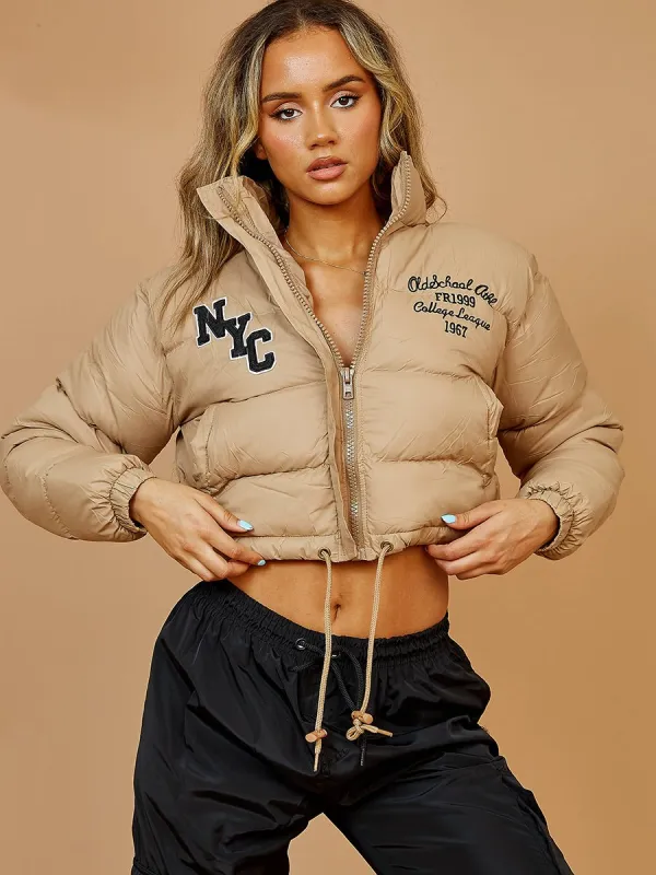Emy NYC Embroidered Cropped Puffer Jacket In Stone sold by Vivichi