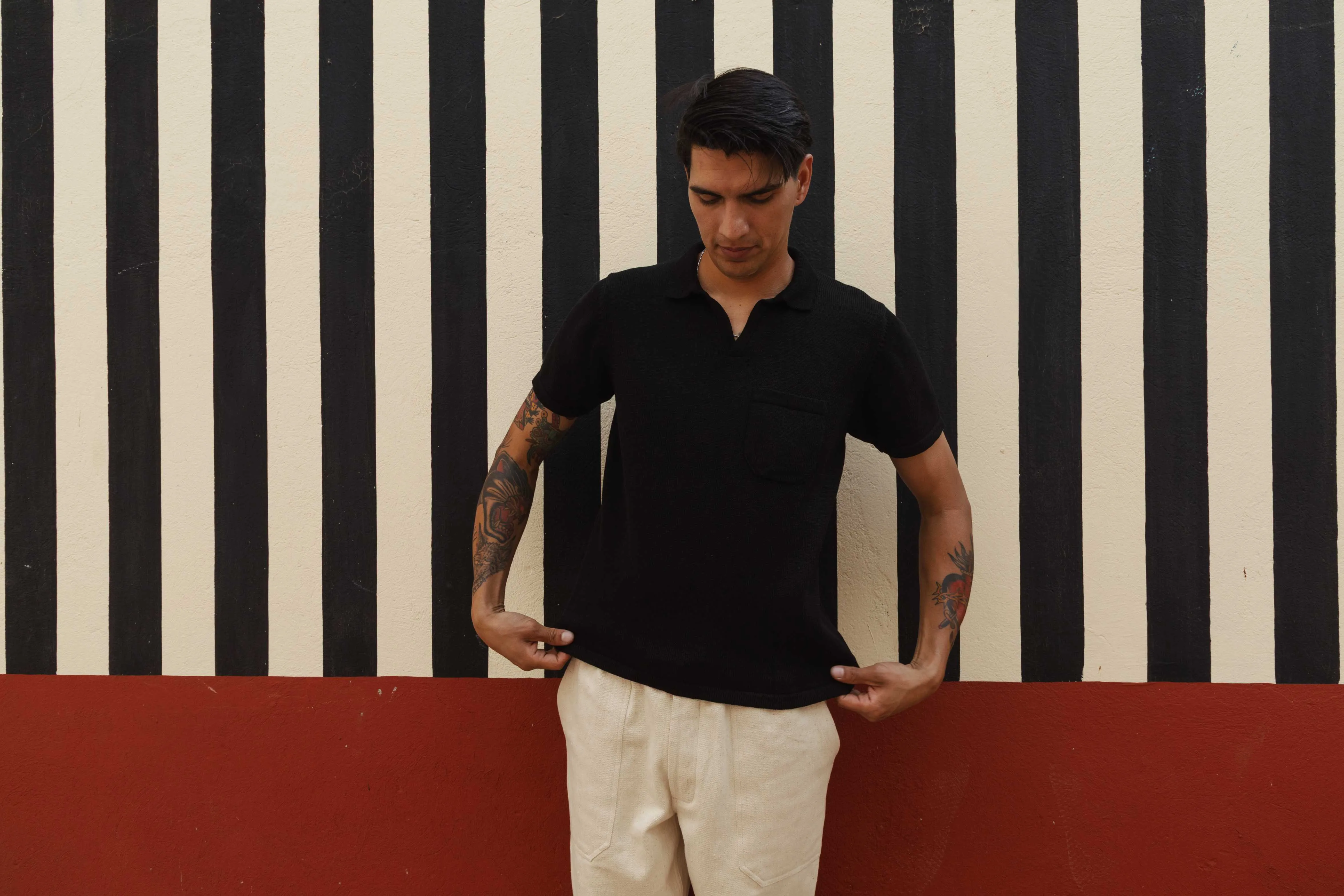 MANBIR JOHNNY COLLAR SS KNIT TEE IN BLACK sold by The Umber & Ochre
