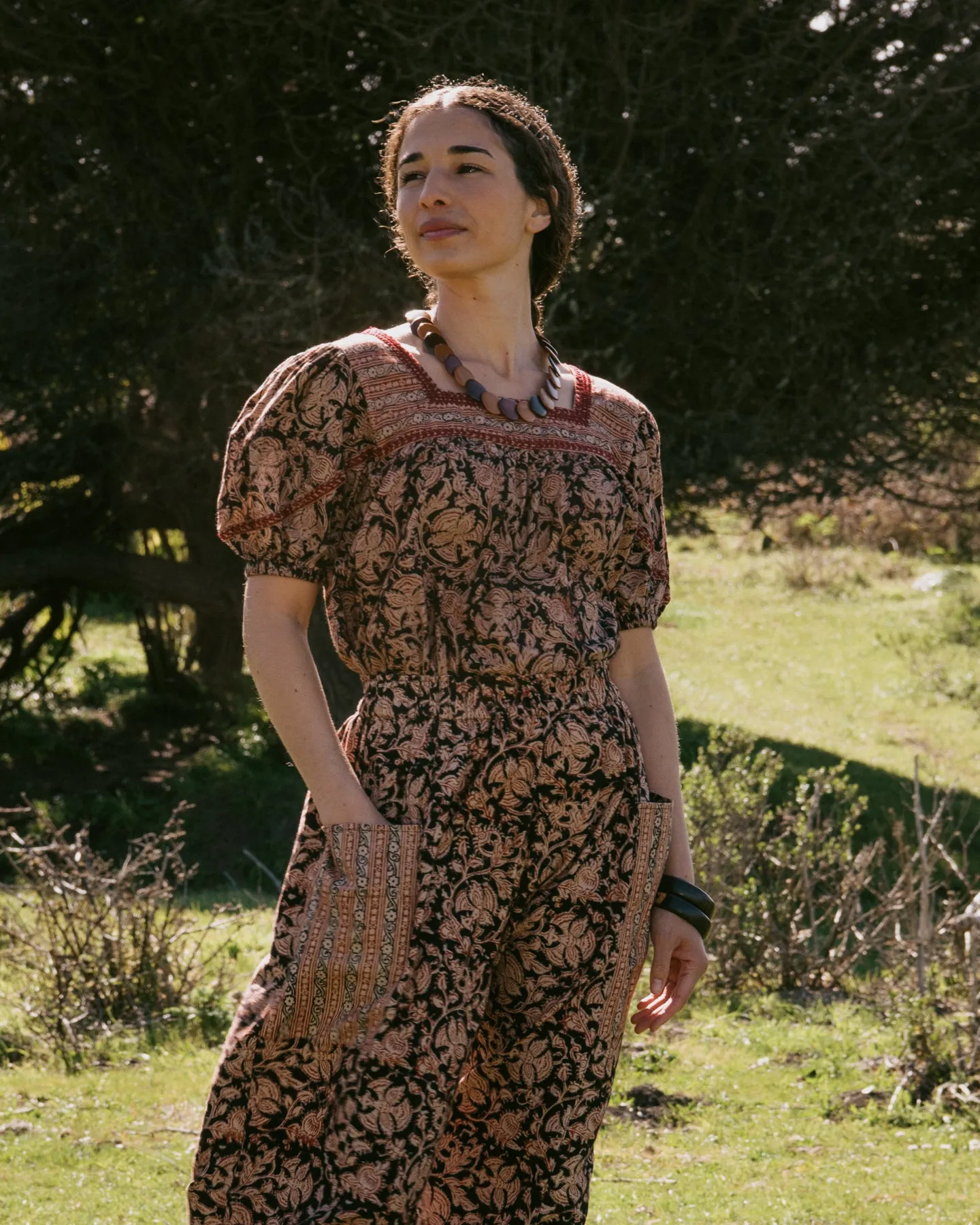 Devika S/S Peasant Top in Black Border sold by The Umber & Ochre