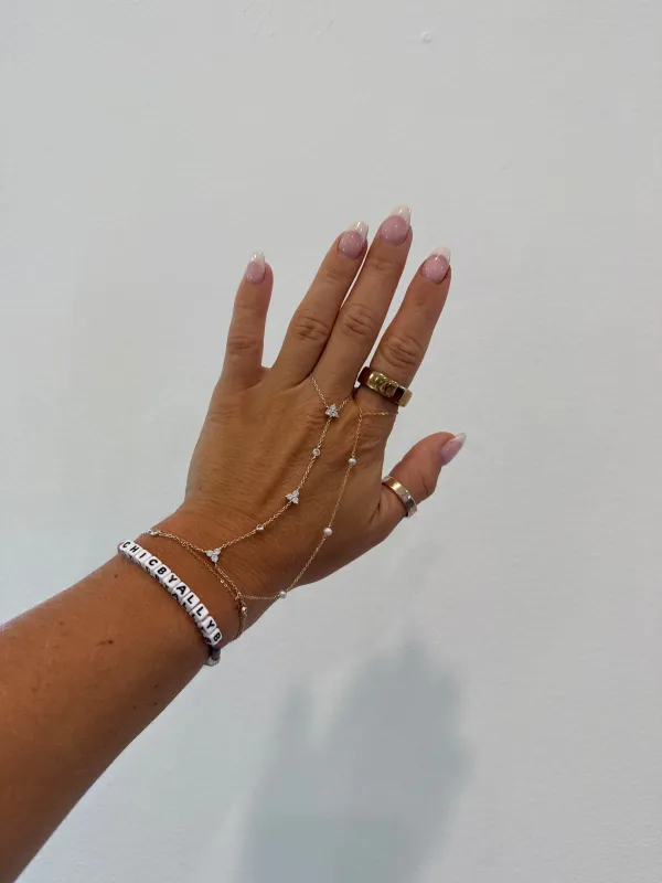 Cleo Pearl Hand Chain Bracelet Gold sold by Chic by Ally B