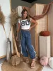 PRE-ORDER* Tailgate Bow Tie Pants Denim (Ships 9/4) sold by Chic by Ally B