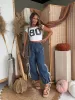 PRE-ORDER* Tailgate Bow Tie Pants Denim (Ships 9/4) sold by Chic by Ally B