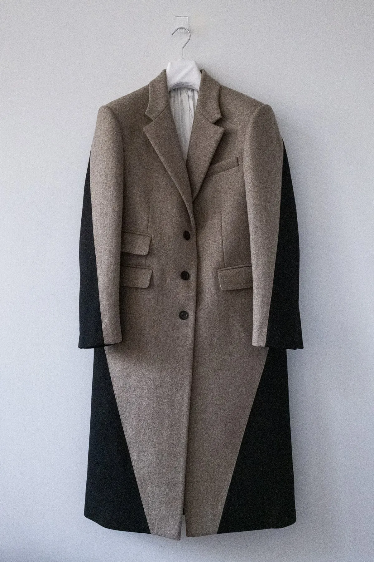 TWISTED COAT sold by Peter Do