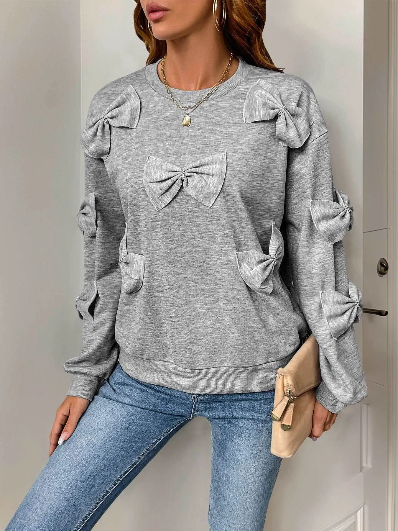 Bows Oversized Crewneck Long Sleeve Sweatshirt sold by CRAVE by Frederick Wilhelm